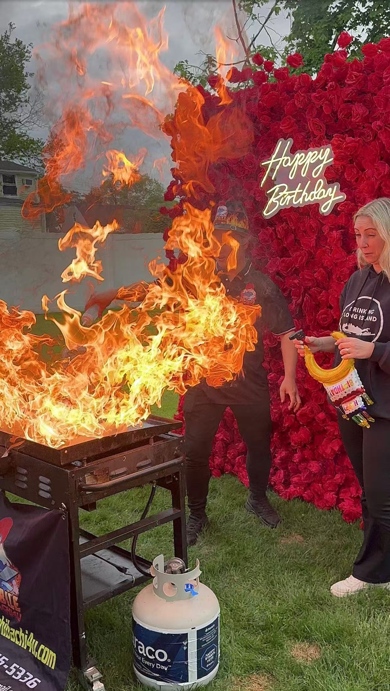 Hibachi fire show performance at backyard party